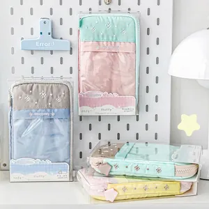 Soft padded multipurpose stationery pouch in pastel colors with clear retail packaging