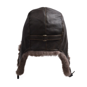 Detail view of winter pilot hat featuring brown leather, faux fur lining and adjustable strap