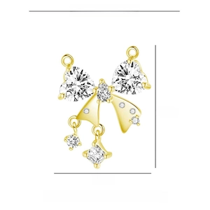Detail view of a gold-plated copper bow pendant set with sparkling zircon gemstones