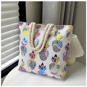 Canvas tote bag with colorful pineapple print and thick braided rope handles