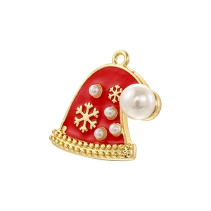 Detailed view of Christmas hat pendant with red enamel, gold snowflakes and white pearl