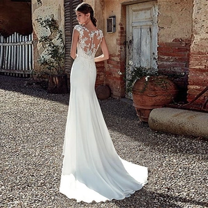 Elegant white lace mermaid wedding dress with open back embroidery and petite train