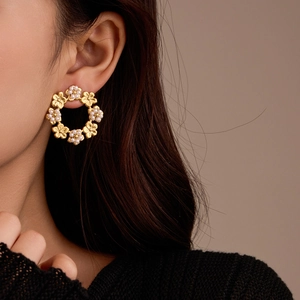18K gold plated stainless steel flower hoop earrings with white pearls on a model