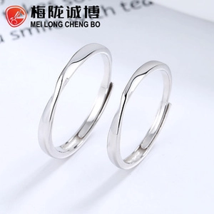 Macro view of minimalist 925 sterling silver Mobius rings with adjustable open bands