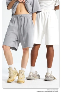 Detailed close-up of retro 420g washed cotton sports shorts in light grey and white