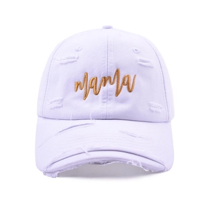 Close-up of golden mama embroidery on distressed lavender cotton baseball cap