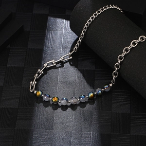 Silver steel chain necklace with iridescent gray blue natural stone beads in macro view