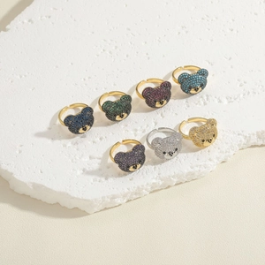 Detailed view of adjustable bear rings with multi-colored cubic zirconia micro-paving