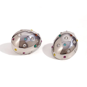 Irregular oval silver earrings with colorful rhinestones in a liquid metal design