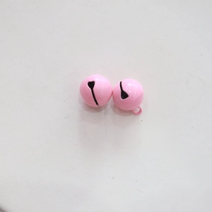 Detail view of two 14mm pink metal candy bells with small hanging rings for DIY crafts