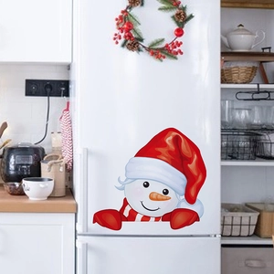 Festive Christmas snowman wall sticker with red hat on a white double-door refrigerator