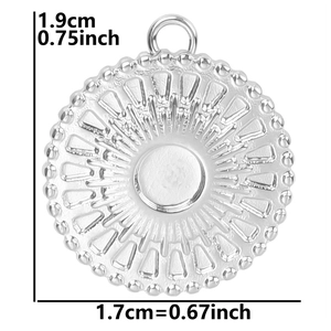 Detailed view of silver stainless steel pendant with radial pattern and size measurements
