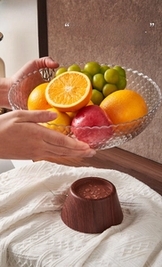 Detail of 2-in-1 fruit bowl with wood grain base showing drainage holes and usage