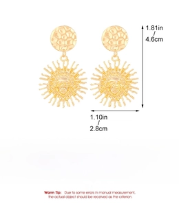 Detailed view of gold sun face earrings with dimensions and weight in English text