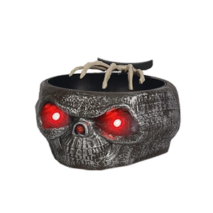 Animated Halloween skull candy bowl with glowing red eyes and moving skeleton hand
