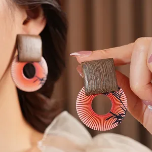 Retro geometric earrings with square wood top and bamboo print circular resin pendant