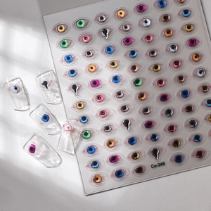 Detailed 3D evil eye nail stickers with metallic finish and gold foil accents