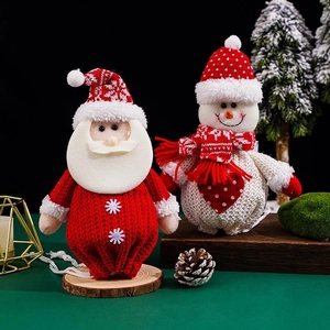 Knitted Christmas gift bags with 3D Santa and Snowman dolls for holiday treats