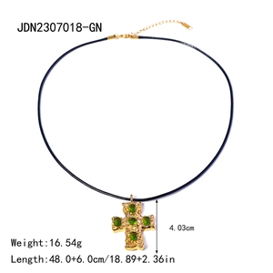 18k gold stainless steel cross necklace with five green gems on black cord chain