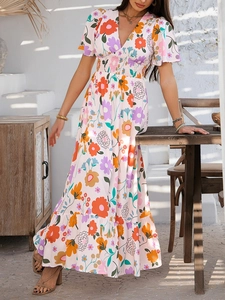 Detail of V-neck floral print dress with bohemian patterns and short sleeves