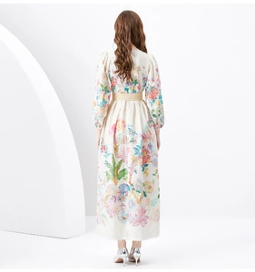 Detail of floral print maxi dress featuring elegant lantern sleeves and lace cuffs back view