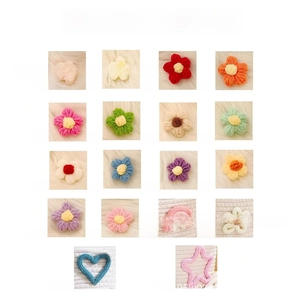 Detailed selection of eighteen colorful crocheted flower, star and heart patches for bags