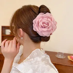 Elegant large fabric camellia flower hair claw clip in pink for French style hairstyles