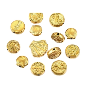 Assorted gold stainless steel large hole beads featuring celtic and shell designs