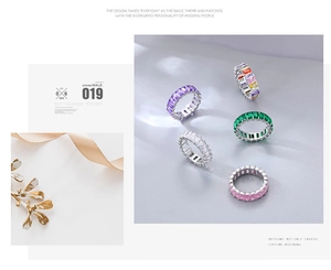 Detailed view of colorful square-cut gemstone rings in elegant silver settings