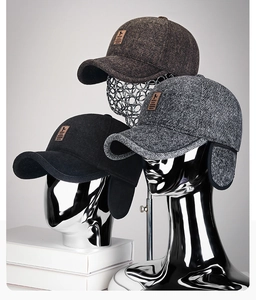 Detail showing the textured tweed fabric and folding ear flaps on winter baseball caps