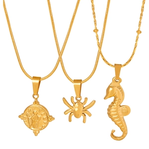 Gold geometric animal pendants with spider and seahorse on sleek snake bone chains