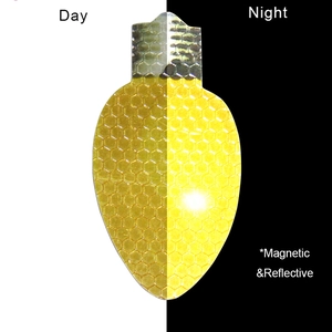 Day and night comparison of golden magnetic reflective Christmas bulb car stickers