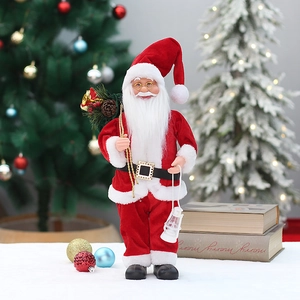 Detail of 18-inch standing Santa figure with classic red outfit and handheld lantern