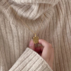 925 Sterling silver gold necklace with rectangular pendant worn on beige knit sweater