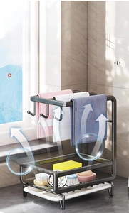 Detail of wall-mounted kitchen sink organizer with drip tray for sponges and towels
