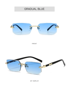 Detail view of rimless rectangular sunglasses with gradual blue lenses and gold metal bridge