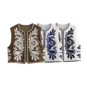 Detailed close-up of intricate floral embroidery on Y2K vintage style cropped vests