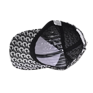 Internal view of a printed baseball cap showing the 100% polyester lining and inner label