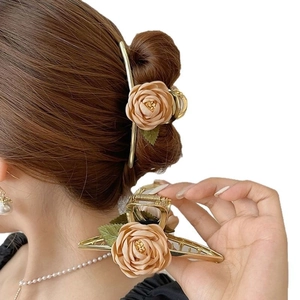 Elegant gold metal flower hair claw with beige fabric roses and green leaves for women