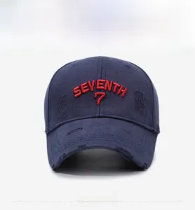 Close-up of vintage navy blue baseball cap with red 3D embroidery and distressed details