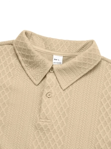 Close-up of khaki textured knit polo collar with dual buttons and polyester size label