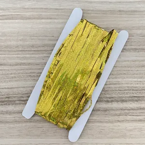 Golden laser tinsel fringe curtain roll for festive party decoration on white card