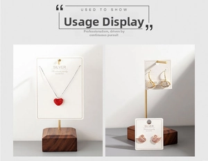 Macro shot of silver jewelry set with swan and heart icons on premium white display cards