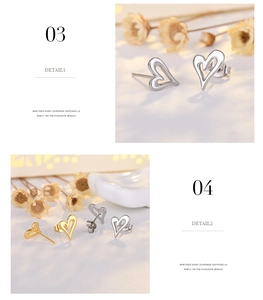 Close-up of 18K gold and silver hollow heart earrings with elegant polished finish