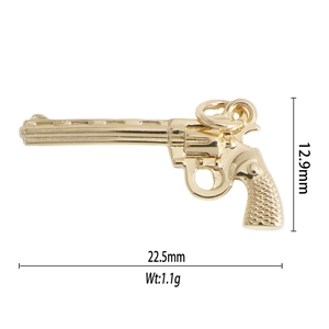 Detailed view of golden revolver pendant with dimensions 12.9mm x 22.5mm and 1.1g weight