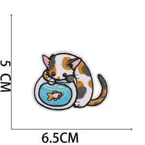 Detail of cartoon cat embroidery patch with goldfish bowl and 6.5cm size markings