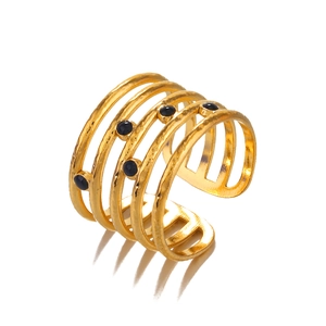 Gold five-layer stainless steel ring with black round stones and textured finish