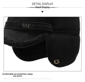 Detail of winter trapper hat with thick black fleece lining and protective ear flaps
