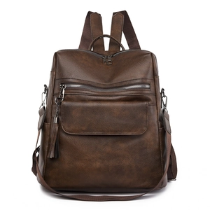Brown faux leather fashion backpack for women with multiple zippers and 14 inch laptop space