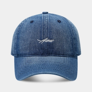 Classic blue denim baseball cap featuring white Asher embroidery on a light background